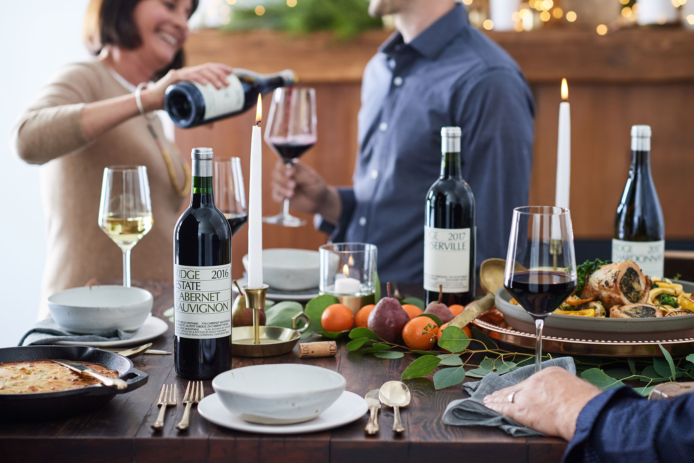 a couple sharing a glass of wine.