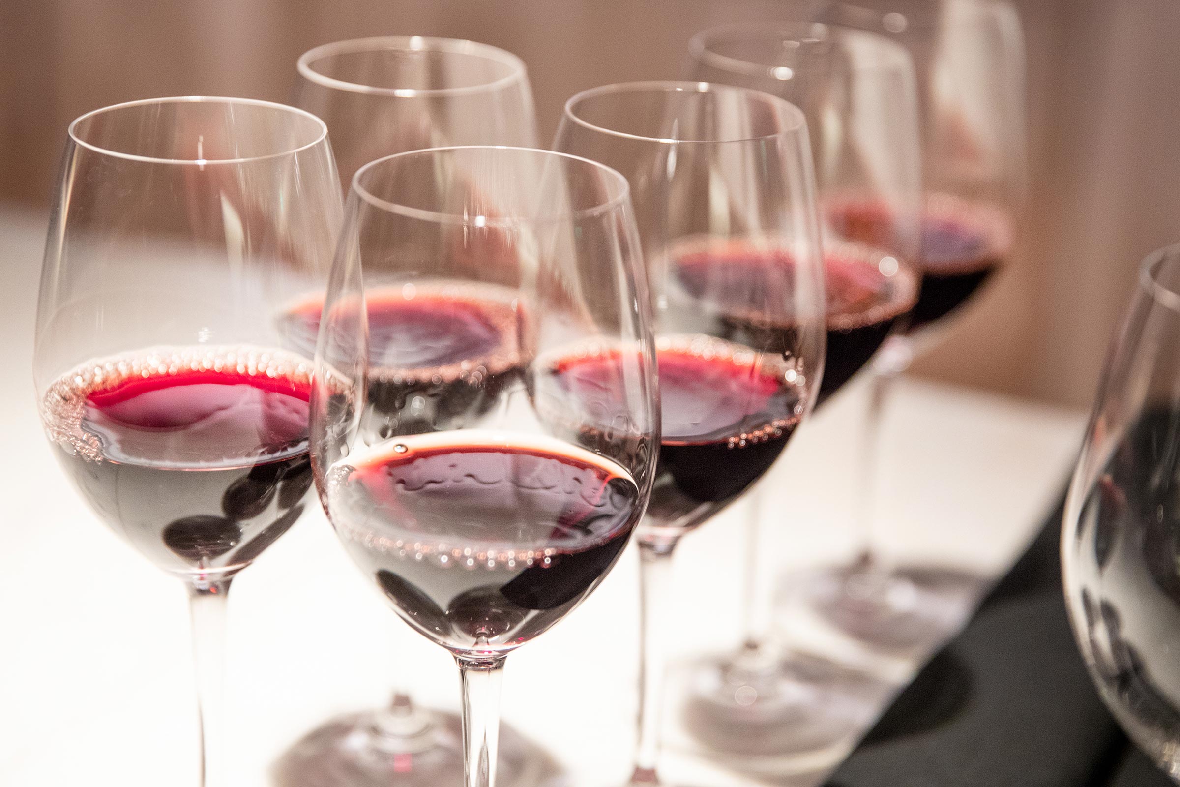 Wine tasting glasses with red wine.