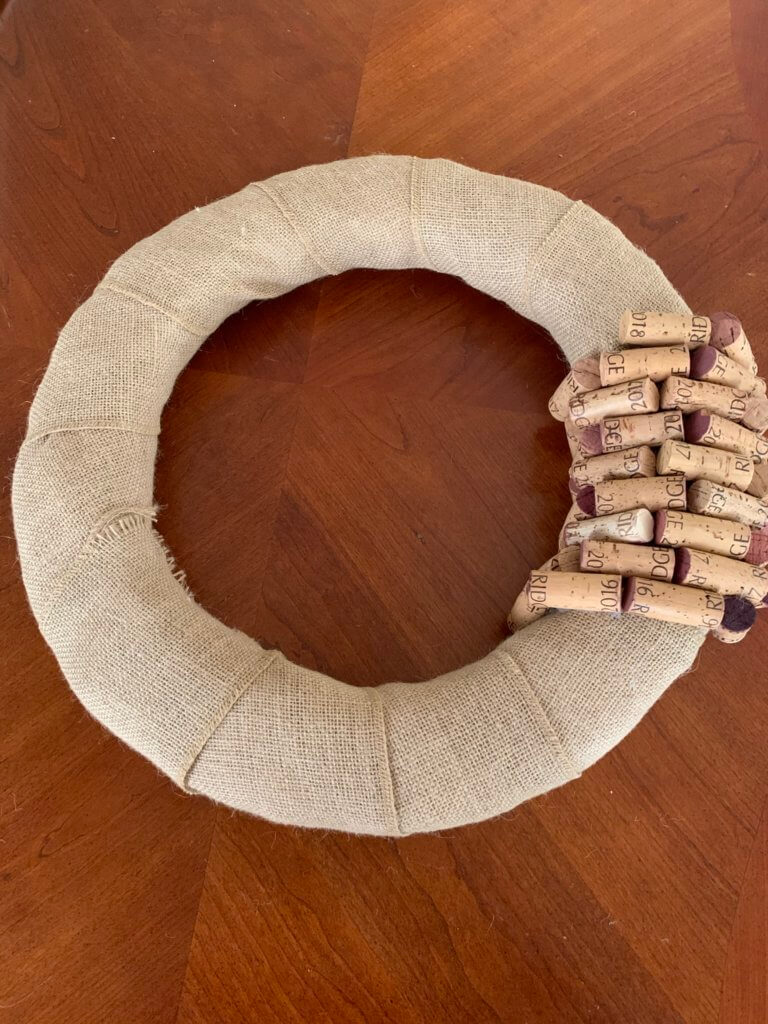 Making the DIY wine cork wreath project.
