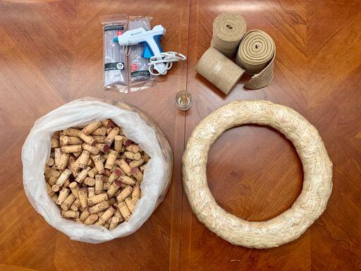Supplies to be used for the DIY wine cork wreath project.