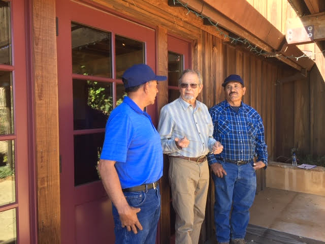 Paul Draper and two vineyard workers